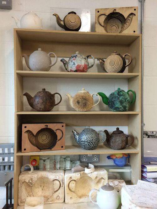 Teapots on shelves